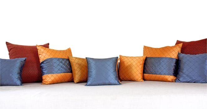 The colorful pillows scattered on the table.