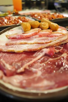 raw sausage and  fresh sliced pork and beef prepare for cooking.