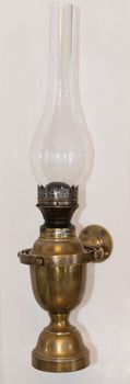 Kerosene vintage lamp fixed on a wall