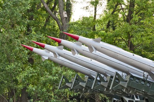 Rocket launchers against the background of green trees