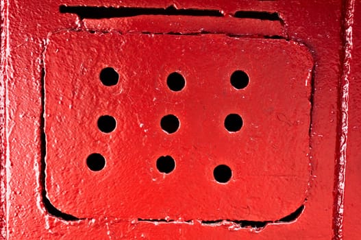 Red ventilating lattice with round holes