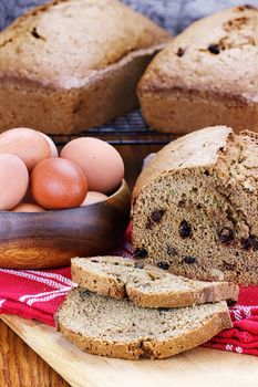 Freshly made and sliced zucchini bread with fresh eggs. 
