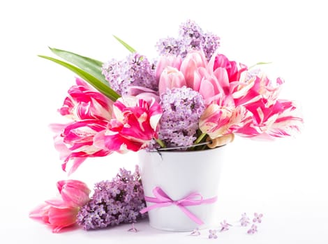 Bouquet from pink tulips and lilac on white