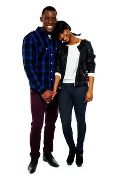 African young couple holding hands. Woman with her head on mans shoulder