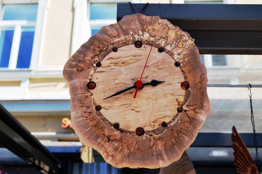 Handmade wooden clock decorated with amber flint stones.