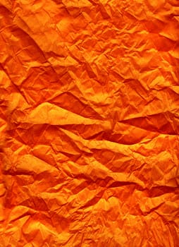 Wrinkled orange silk paper background texture