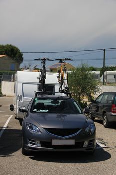 Middlesized car and caravan combination, ready to leave for vacation