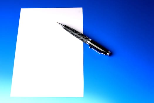 modern beautiful pen and sheet of white paper on a dark blue background