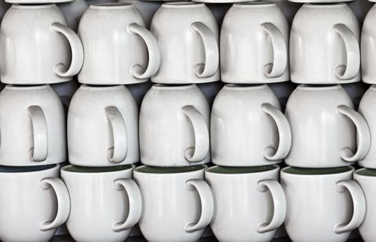 White ceramic cups on the market stall
