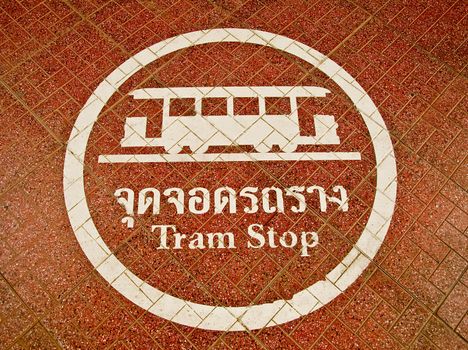 The Sign of tram stop on floor background