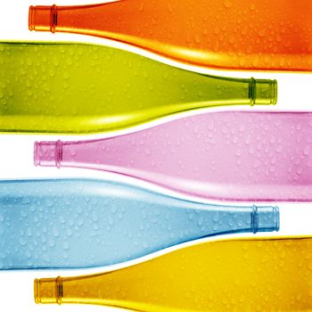 Set of colored empty glass bottles background.