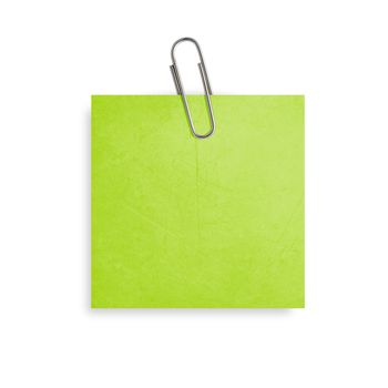 Green Note paper with paper clip on white background.