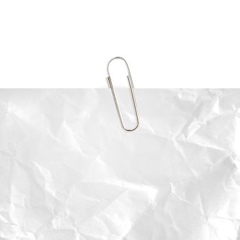 Gray note paper with paper clip on white background.