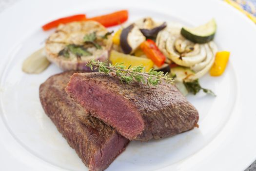 juicy lamb loin with thyme and oven baked summer vegetables