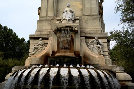 Saved natural parks in Europe trees and statues. Fountain. Madrid