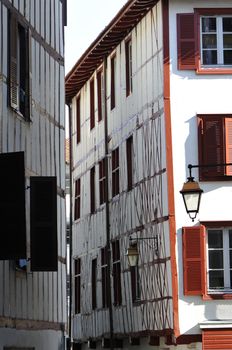 Little Space between Two Typical Red and White Bask Buildings