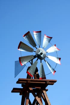 A windmill against blue sky