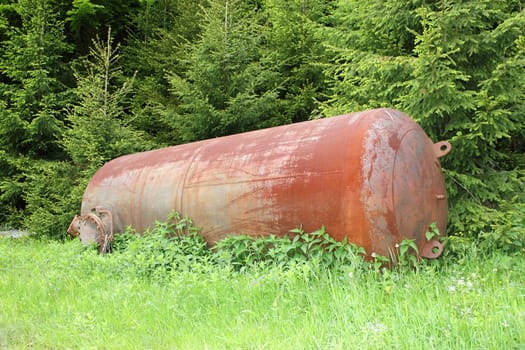 old rusty cauldron left in the woods