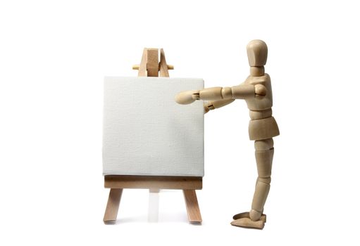 wooden doll with painters  easel