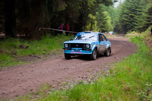 MALLOW, IRELAND - MAY 19: J. Coleman driving Ford Escort at the Jim Walsh Cork Forest Rally on May 19, 2012 in Mallow, Ireland. 4th round of the Valvoline National Forest Rally Championship.