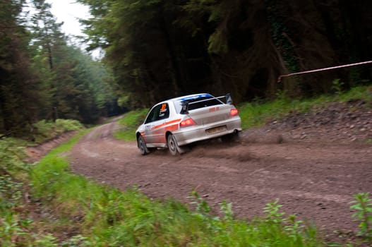 MALLOW, IRELAND - MAY 19: G. Lucey driving Mitsubishi Evo at the Jim Walsh Cork Forest Rally on May 19, 2012 in Mallow, Ireland. 4th round of the Valvoline National Forest Rally Championship.