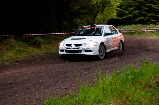 MALLOW, IRELAND - MAY 19: G. Lucey driving Mitsubishi Evo at the Jim Walsh Cork Forest Rally on May 19, 2012 in Mallow, Ireland. 4th round of the Valvoline National Forest Rally Championship.