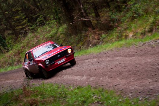 MALLOW, IRELAND - MAY 19: A. Commins driving Ford Escort at the Jim Walsh Cork Forest Rally on May 19, 2012 in Mallow, Ireland. 4th round of the Valvoline National Forest Rally Championship.