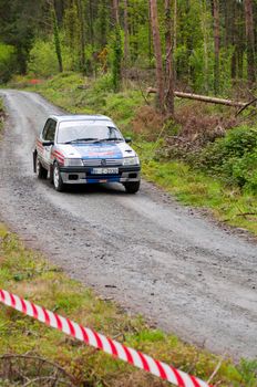 MALLOW, IRELAND - MAY 19: I. Downey driving Opel Corsa at the Jim Walsh Cork Forest Rally on May 19, 2012 in Mallow, Ireland. 4th round of the Valvoline National Forest Rally Championship.  