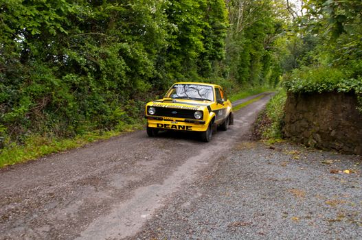 MALLOW, IRELAND - MAY 19: J. Deane driving Ford Escort at the Jim Walsh Cork Forest Rally on May 19, 2012 in Mallow, Ireland. 4th round of the Valvoline National Forest Rally Championship.