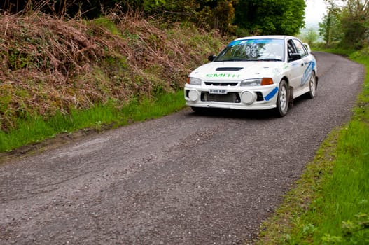 MALLOW, IRELAND - MAY 19: D. Smith driving Mitsubishi Evo at the Jim Walsh Cork Forest Rally on May 19, 2012 in Mallow, Ireland. 4th round of the Valvoline National Forest Rally Championship.