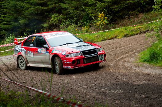 MALLOW, IRELAND - MAY 19: S. Wright driving Mitsubishi Evo at the Jim Walsh Cork Forest Rally on May 19, 2012 in Mallow, Ireland. 4th round of the Valvoline National Forest Rally Championship.