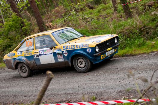 MALLOW, IRELAND - MAY 19: M. Nevin driving Ford Escort at the Jim Walsh Cork Forest Rally on May 19, 2012 in Mallow, Ireland. 4th round of the Valvoline National Forest Rally Championship.