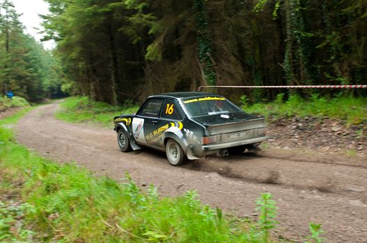 MALLOW, IRELAND - MAY 19: M. Conlon driving Ford Escort at the Jim Walsh Cork Forest Rally on May 19, 2012 in Mallow, Ireland. 4th round of the Valvoline National Forest Rally Championship.