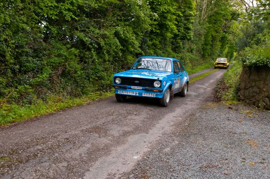 MALLOW, IRELAND - MAY 19: P. Fitzgerald driving Ford Escort at the Jim Walsh Cork Forest Rally on May 19, 2012 in Mallow, Ireland. 4th round of the Valvoline National Forest Rally Championship.