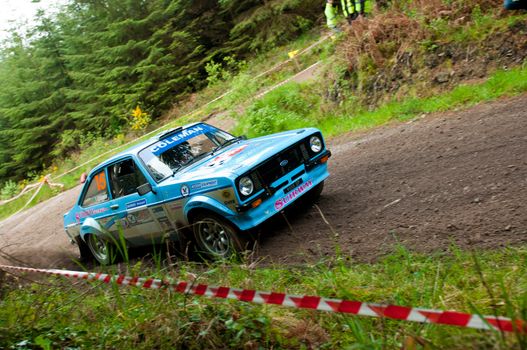 MALLOW, IRELAND - MAY 19: J. Coleman driving Ford Escort at the Jim Walsh Cork Forest Rally on May 19, 2012 in Mallow, Ireland. 4th round of the Valvoline National Forest Rally Championship.