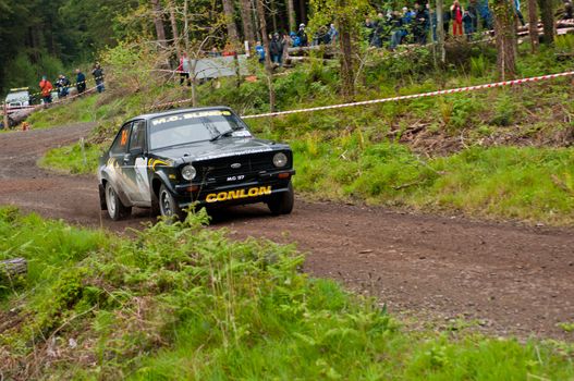 MALLOW, IRELAND - MAY 19: M. Conlon driving Ford Escort at the Jim Walsh Cork Forest Rally on May 19, 2012 in Mallow, Ireland. 4th round of the Valvoline National Forest Rally Championship.