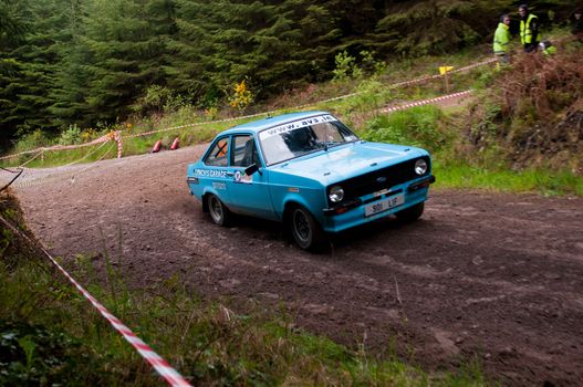 MALLOW, IRELAND - MAY 19: L. Lynch driving Ford Escort at the Jim Walsh Cork Forest Rally on May 19, 2012 in Mallow, Ireland. 4th round of the Valvoline National Forest Rally Championship.