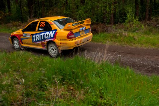 MALLOW, IRELAND - MAY 19: P. Barrett driving Mitsubishi Evo at the Jim Walsh Cork Forest Rally on May 19, 2012 in Mallow, Ireland. 4th round of the Valvoline National Forest Rally Championship.