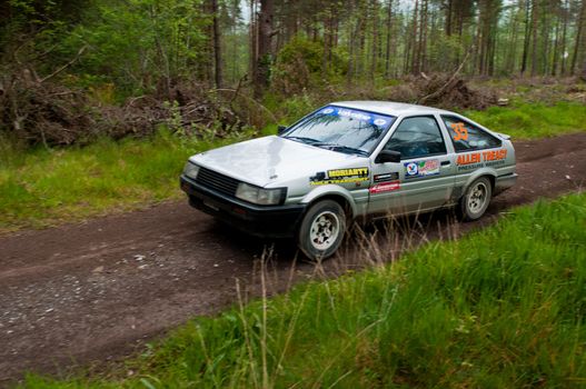 MALLOW, IRELAND - MAY 19: A. Tracey driving Toyota Corolla at the Jim Walsh Cork Forest Rally on May 19, 2012 in Mallow, Ireland. 4th round of the Valvoline National Forest Rally Championship.