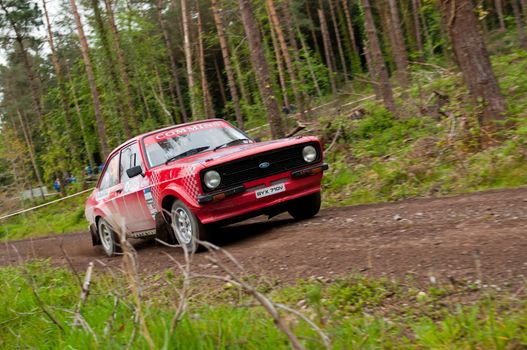 MALLOW, IRELAND - MAY 19: A. Commins driving Ford Escort at the Jim Walsh Cork Forest Rally on May 19, 2012 in Mallow, Ireland. 4th round of the Valvoline National Forest Rally Championship.