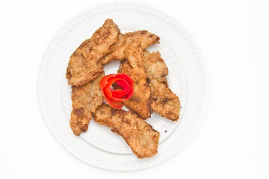 Fried Fish Fillet decorated with tomato pealing