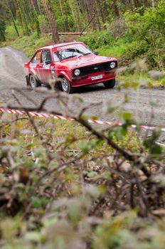 MALLOW, IRELAND - MAY 19: A. Commins driving Ford Escort at the Jim Walsh Cork Forest Rally on May 19, 2012 in Mallow, Ireland. 4th round of the Valvoline National Forest Rally Championship.