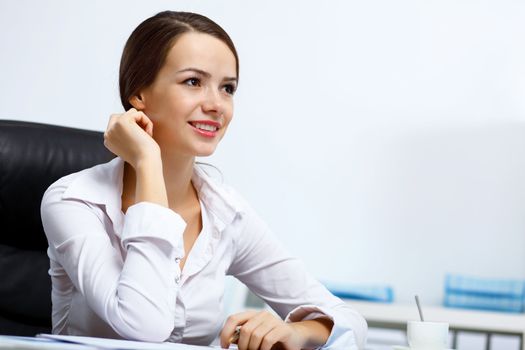 Portrait of young successful businesswoman in the office