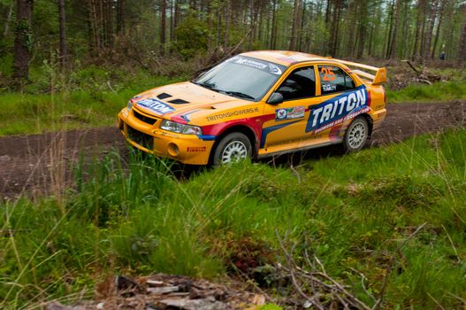 MALLOW, IRELAND - MAY 19: P. Barrett driving Mitsubishi Evo at the Jim Walsh Cork Forest Rally on May 19, 2012 in Mallow, Ireland. 4th round of the Valvoline National Forest Rally Championship.