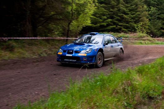 MALLOW, IRELAND - MAY 19: M. Cairns driving Subaru Impreza at the Jim Walsh Cork Forest Rally on May 19, 2012 in Mallow, Ireland. 4th round of the Valvoline National Forest Rally Championship.