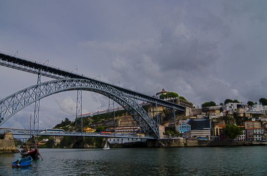 Famous steel bridge Ponte dom Luis above connects Old town Porto with Vila Nova de Gaia at river Duoro, Portugal