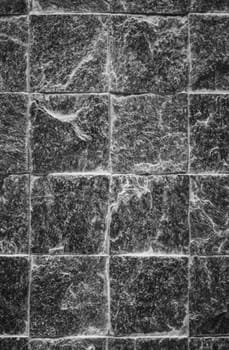 Stone pavement with green grass. Texture or background.