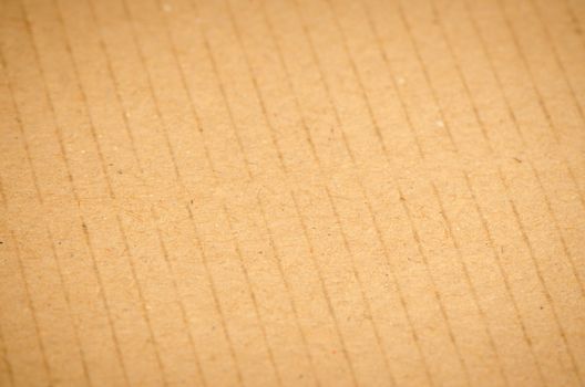 Closeup of textured recycled cardboard with natural fiber parts