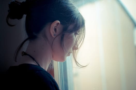 beautiful woman at home near window