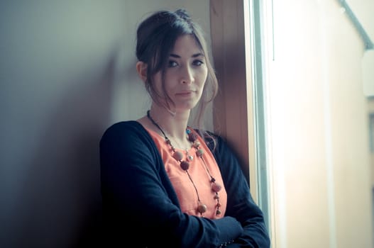 beautiful woman at home near window